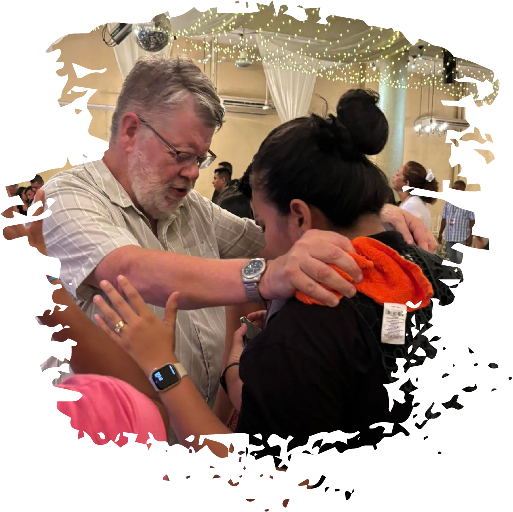 Mark prays over a church leader in Latin America